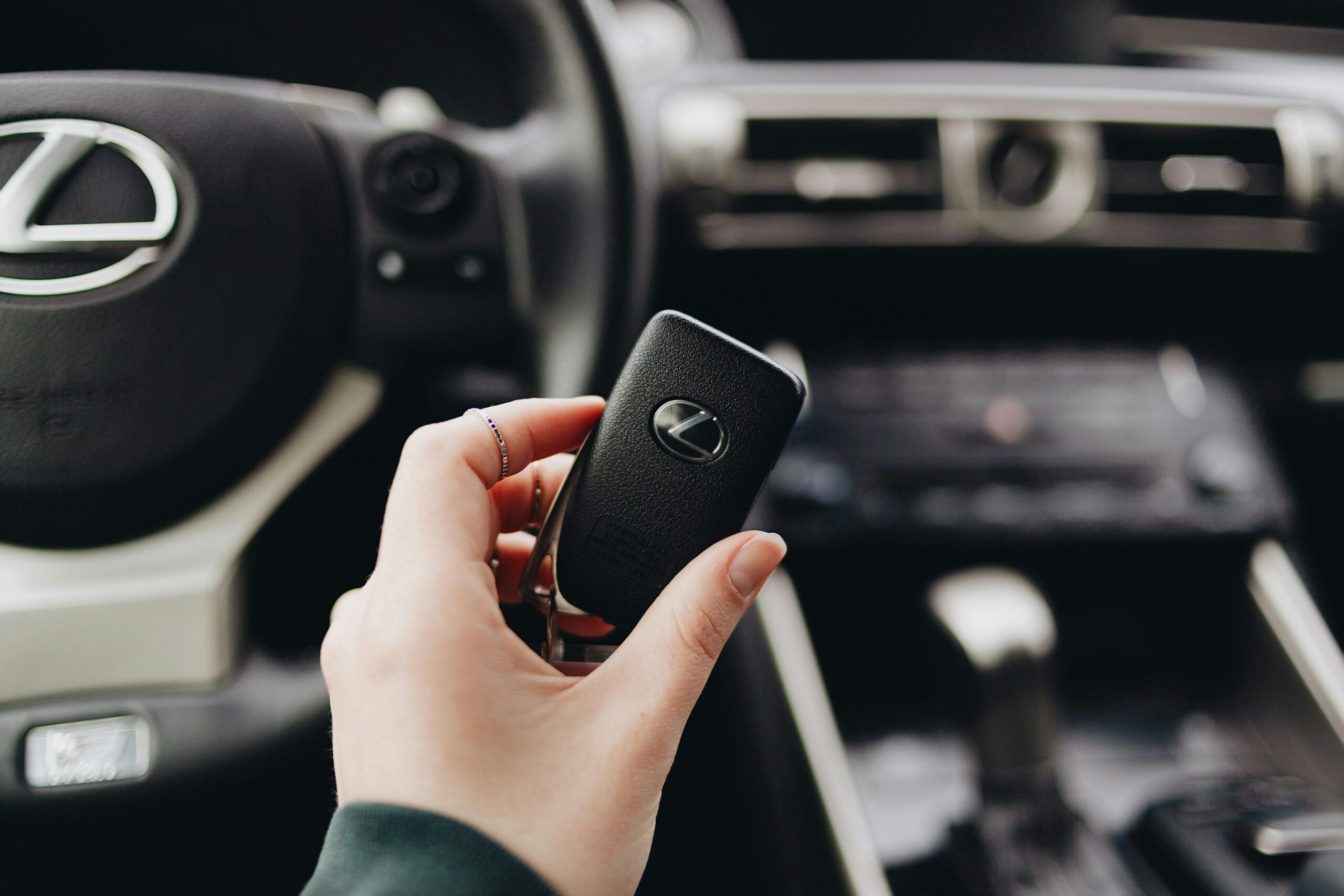 Car key in hand inside vehicle - GT1 turnkey car ordering service in Estonia